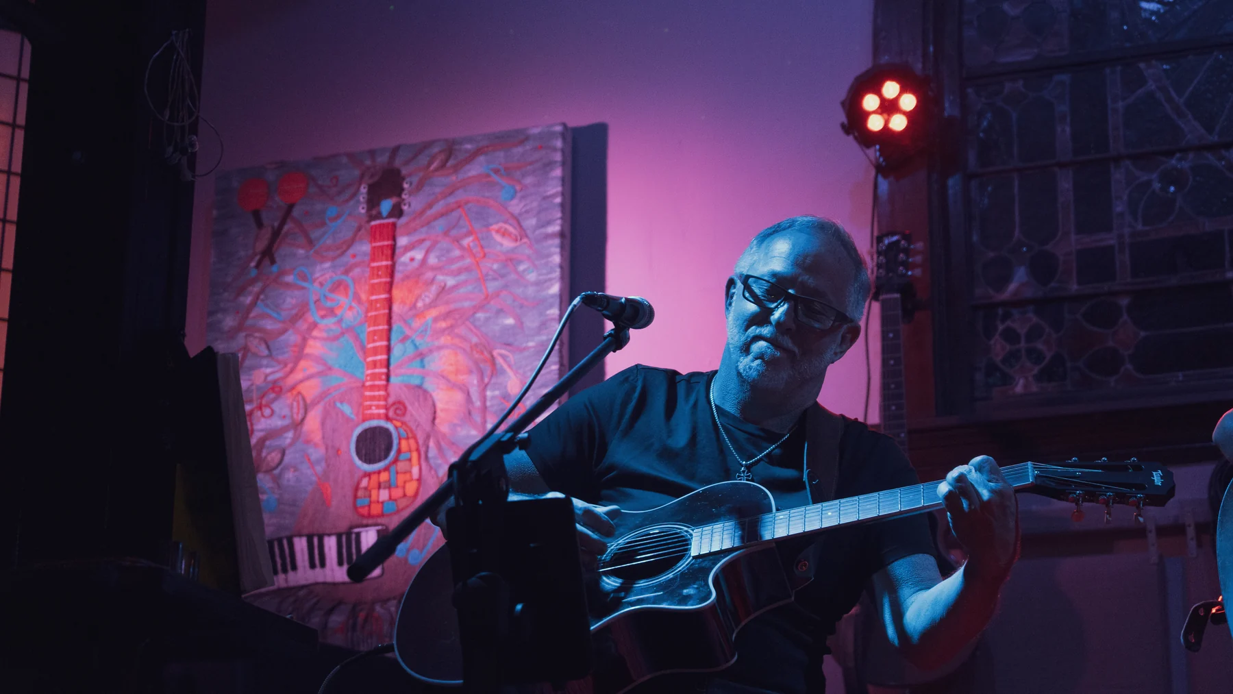 Greg Mebs performing on guitar